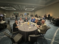 a group of people sitting around a table