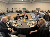 a group of people sitting at a table