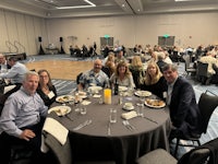 a group of people sitting around a table