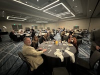 a group of people sitting at a table