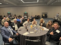 a group of people sitting at a table